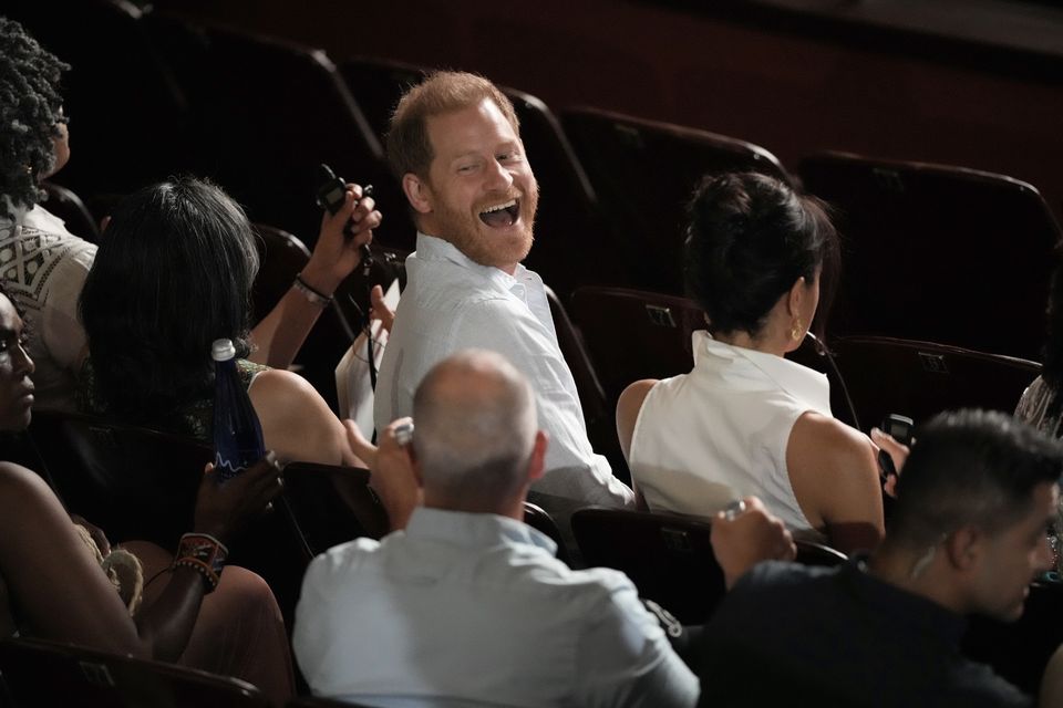 Harry smiles during his four-day Columbia tour. (Ivan Valencia/AP)