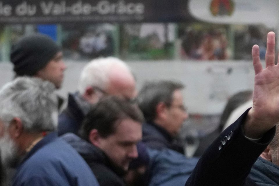 Eric Zemmour, founder of far-right party Reconquete (Renew), waves as he arrives at Notre Dame du Val-de-Grace church (Thibault Camus/AP)