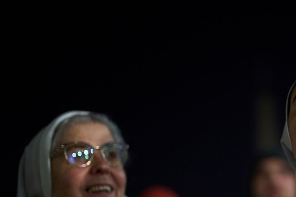 Catholic nuns listen to a recorded message from Pope Francis in St Peter’s Square at The Vatican (Francisco Seco/AP)