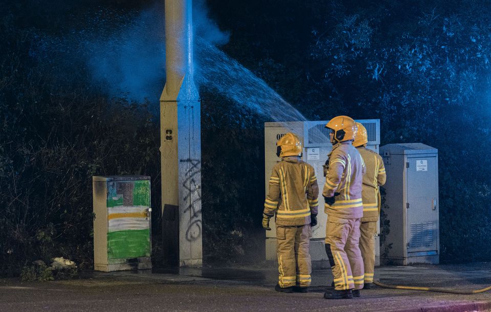 Firefighters deal with an arson at a 5G mast on the Monagh Bypass in west Belfast on July 31st 2024 (Photo by Kevin Scott)
