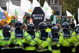 thumbnail: Protestors march as the Garda form a protective ring around Dublin Castle as the Queen attends a state dinner on May 18, 2011 in Dublin