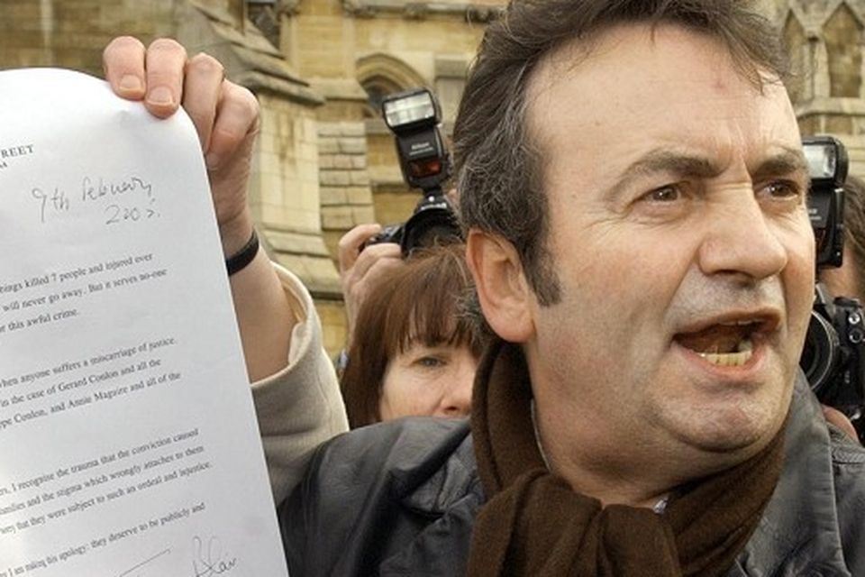 Gerry Conlon outside the House of Commons in 2005 showing the media the letter of apology he received from Prime Minister Tony Blair over his conviction