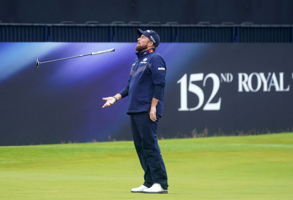 Ireland’s Shane Lowry throws his putter in the air on the 18th during a third round of 77 in the Open (Owen Humphreys/PA)