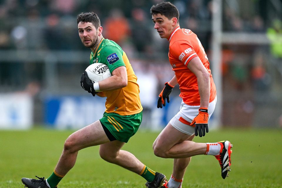 Donegal’s Ryan McHugh tries to avoid the clutches of Armagh’s Rory Grugan in the 2024 Division Two Final