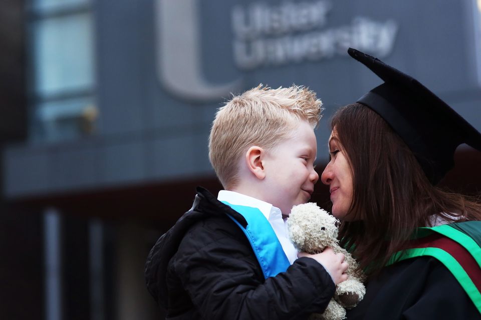 Sladjana Radulovic gets a cuddle from son Roy as she  celebrates her Masters in applied Psychology at the Ulster University Winter Graduations at the Universitys Coleraine campus. Picture John Murphy Aurora PA