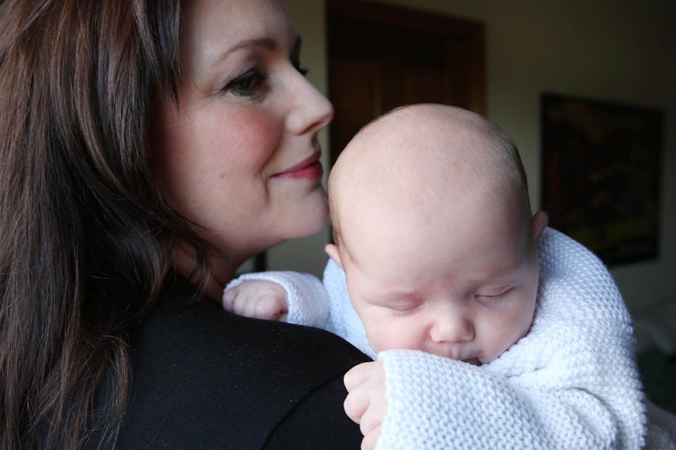 Proud parents: Radio Ulster presenter Kerry McLean with four-week-old daughter Eve