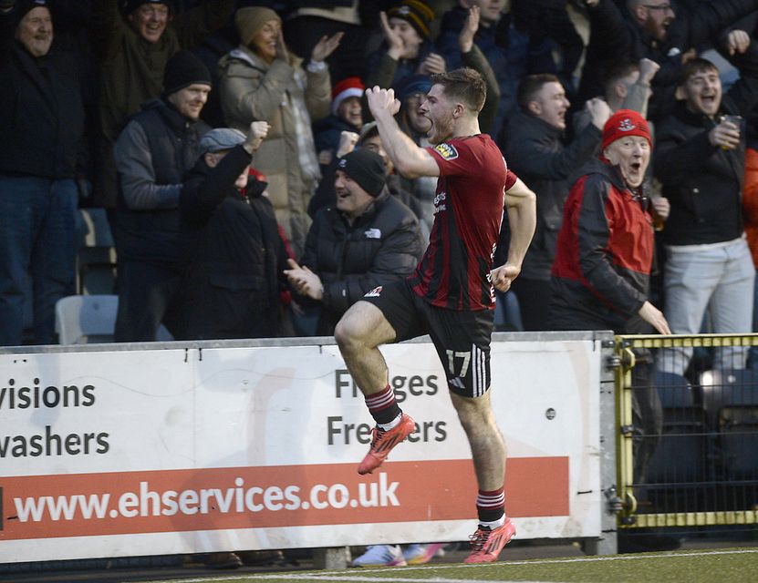 Kieran Offord celebrates his second goal against Cliftonville