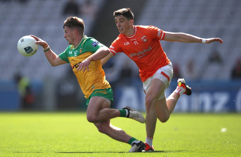 Armagh's Rory Grugan tackles Peadar Mogan of Donegal during the 2024 Division Two Final between the sides