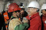 thumbnail: In this photo released by the Chilean presidential press office, Chile's President Sebastian Pinera, right, hugs rescued miner Mario Sepulveda after Sepulveda was rescued from the collapsed San Jose gold and copper mine where he was trapped with 32 other miners for over two months near Copiapo, Chile, early Wednesday Oct. 13, 2010.  (AP Photo/Jose Manuel de la Maza, Chilean presidential press office)