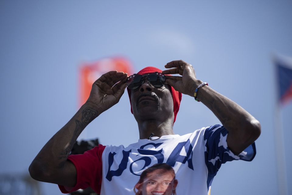 Snoop Dogg attends the women’s pool C beach volleyball match between the US and France at Eiffel Tower Stadium (Louise Delmotte/AP)