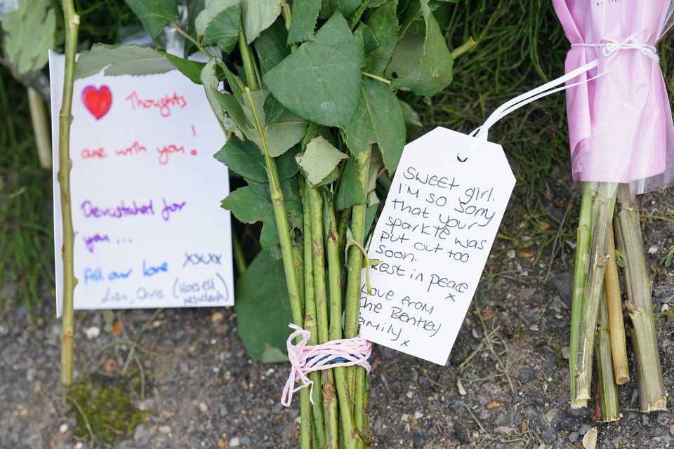 Flowers and notes left outside Sara Sharif’s home in Hammond Road in Woking (Jonathan Brady/PA)