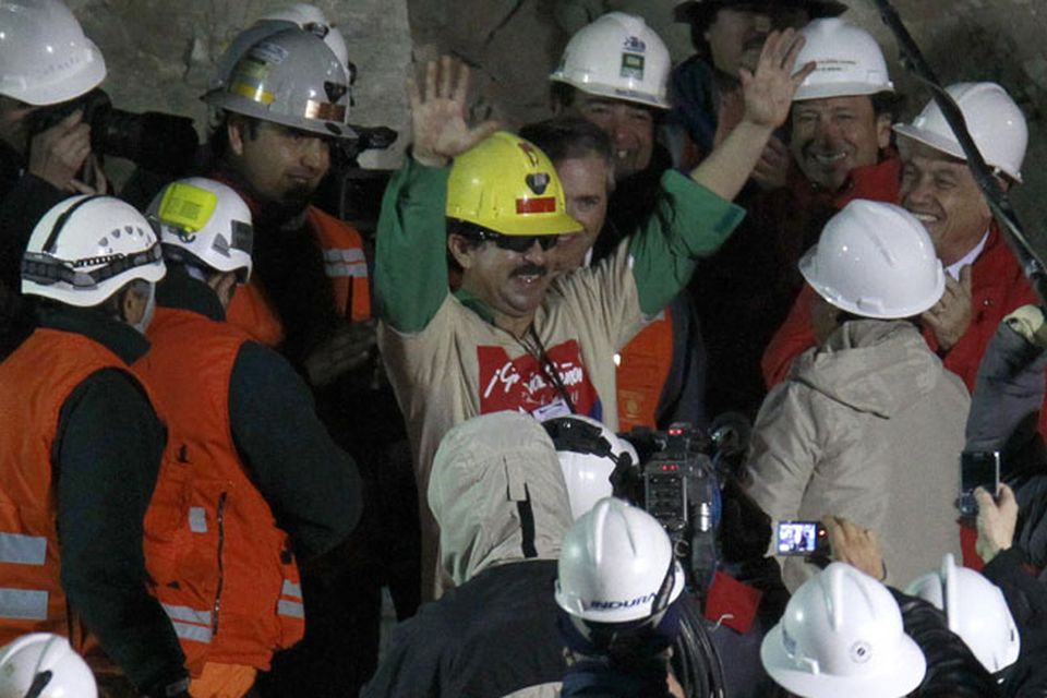 Rescued miner Juan Andres Illanes Palma, third miner to be rescued, salutes at his arrival to the surface from the collapsed San Jose gold and copper mine where he was trapped with 32 other miners for over two months near Copiapo, Chile, Wednesday Oct. 13, 2010.at the San Jose Mine near Copiapo, Chile Wednesday, Oct. 13, 2010.(AP Photo/Roberto Candia)