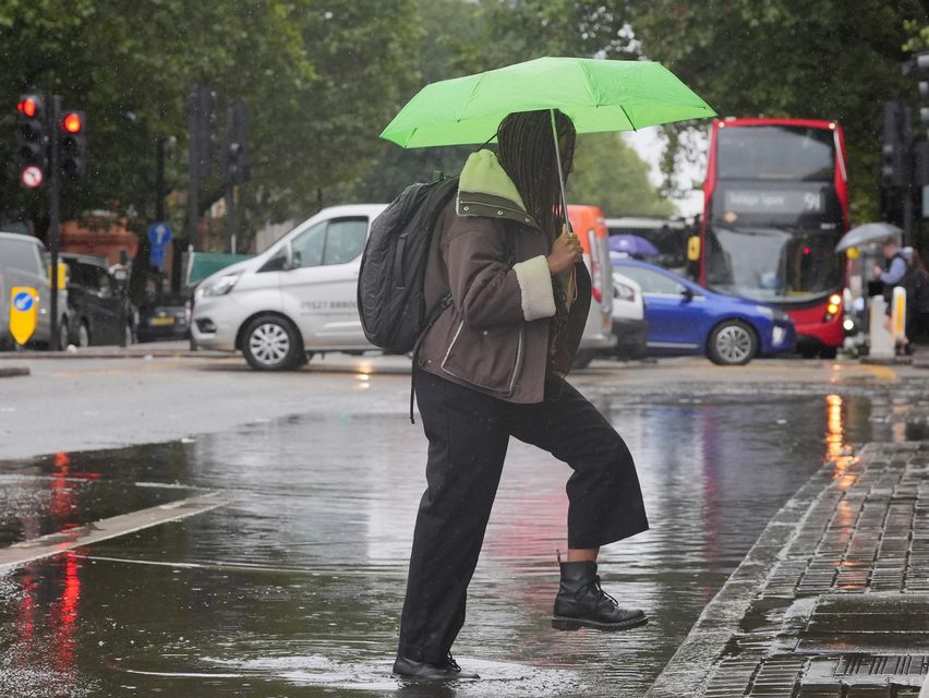 The Met Office warned spells of heavy rain could lead to travel disruption and flooding in places (Jonathan Brady/PA)