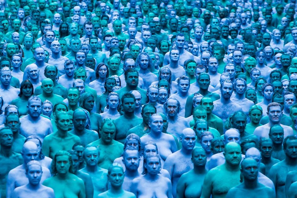 People take part in an installation titled Sea of Hull by artist Spencer Tunick in Hull. PA