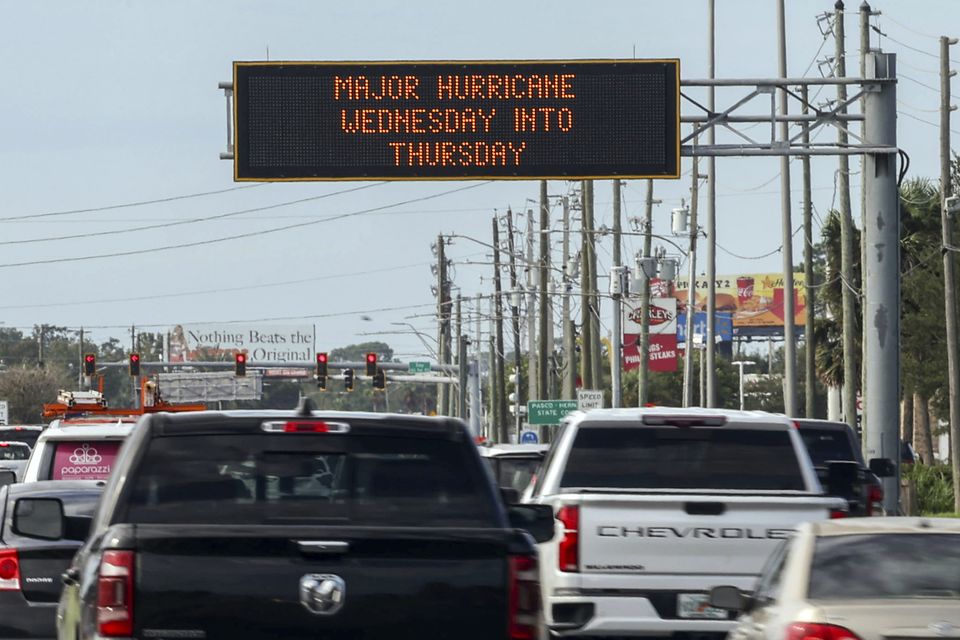 Road signs warn of the impending hurricane (Mike Carlson/AP)