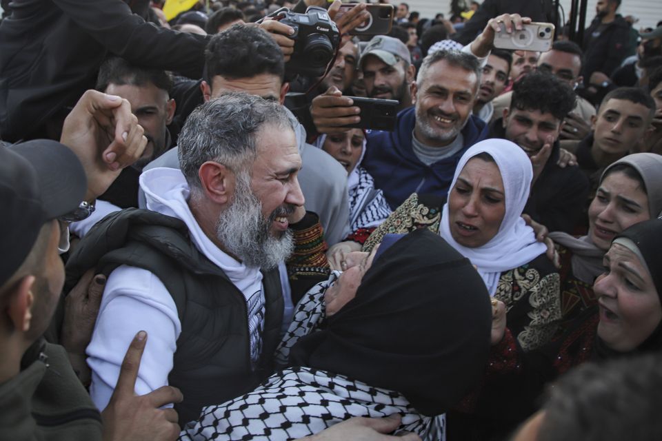 A freed Palestinian prisoner is greeted by relatives (Jehad Alshrafi/AP)