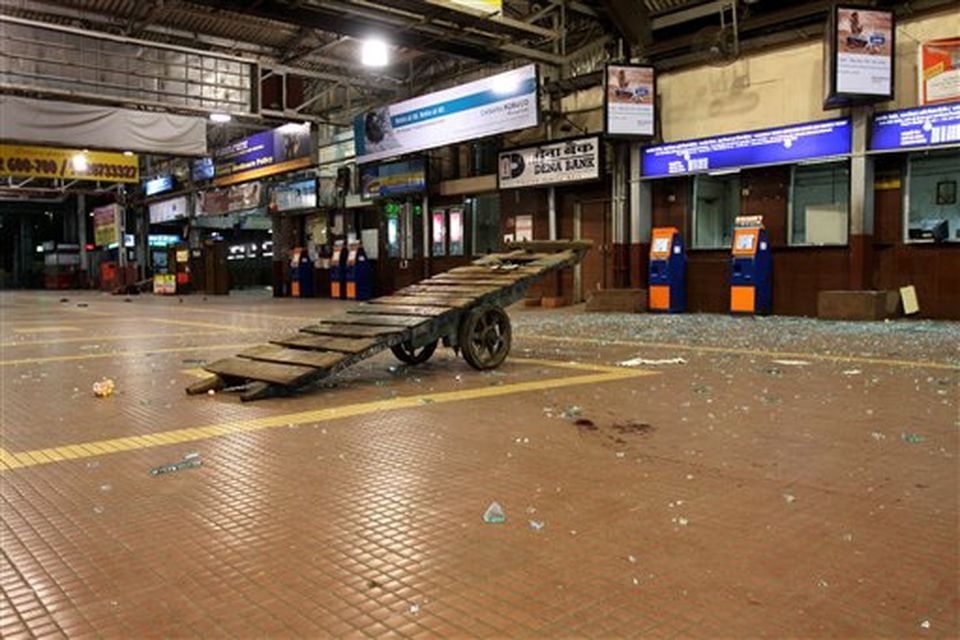 A cart stands amidst shattered glass on an empty platform at the Chhatrapati Shivaji Terminus railway station in Mumbai, India, Wednesday, Nov. 26, 2008. Police say several people have been wounded in a series of attacks by terrorist gunmen at seven sites in Mumbai, including two luxury hotels. A.N. Roy, a senior police officer, says police were battling the gunmen. (AP Photo)