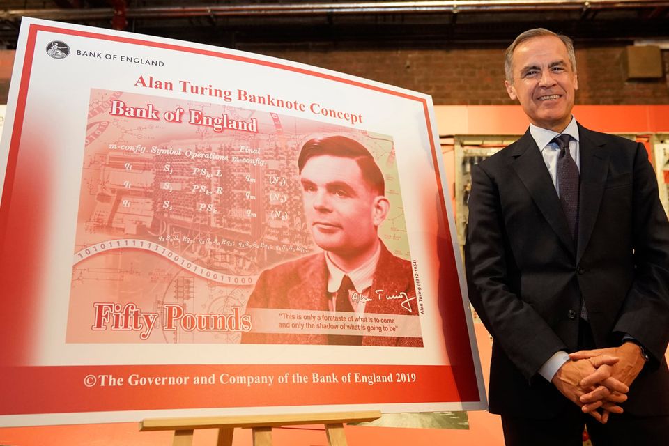 Mark Carney, the Governor of the Bank of England, reveals the image of Alan Turing on the new £50 note