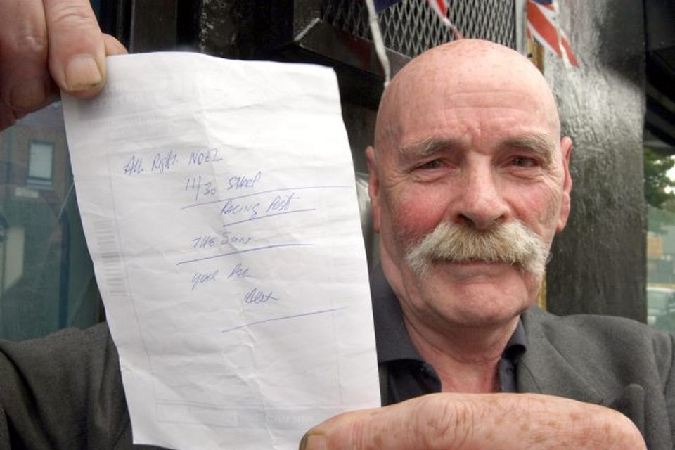 Noel Cairns holds a shopping list given to him by former snooker champion Alex Higgins, near Ulidia House in south Belfast where Higgin's body was discovered.