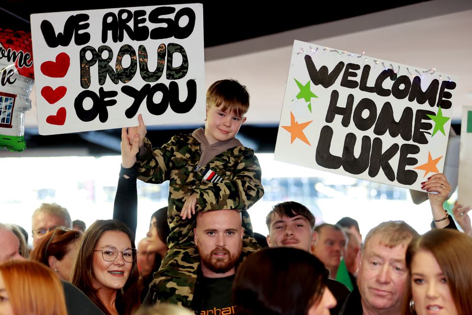 Killian Rowan, aged seven, waits for his uncle, Private Luke Rowan (Liam McBurney/PA)