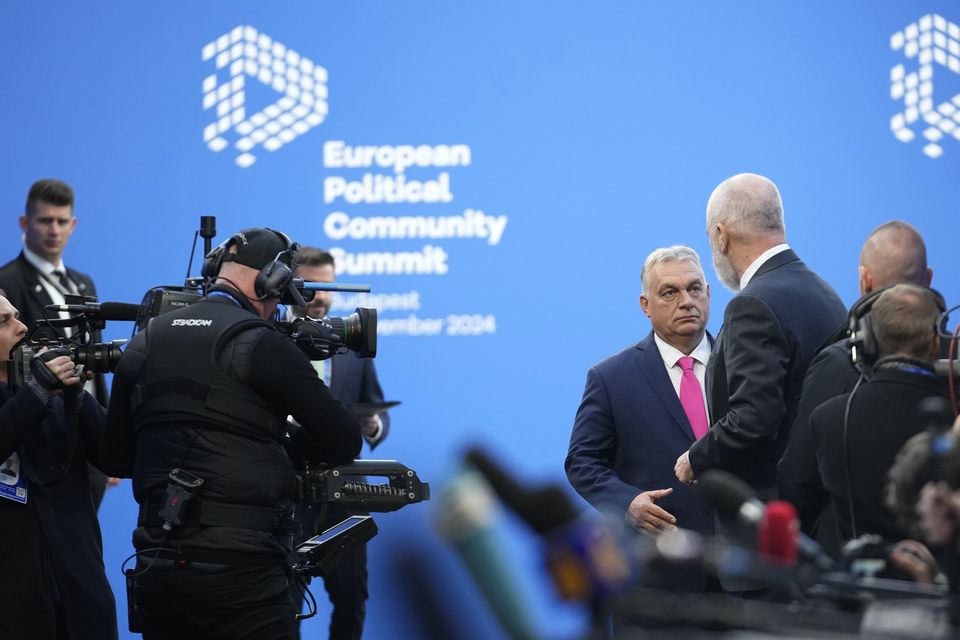 Albania’s Prime Minister Edi Rama, right, speaks with Hungary’s Prime Minister Viktor Orban before the summit (Petr Josek/AP)