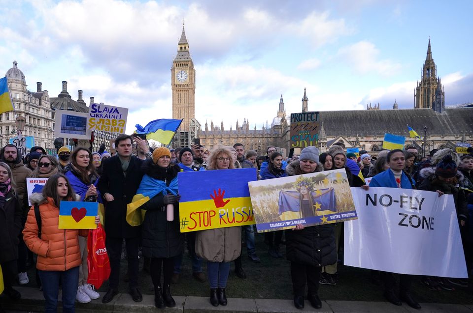 People take part in a demonstration in Parliament Square (Ian West/PA)