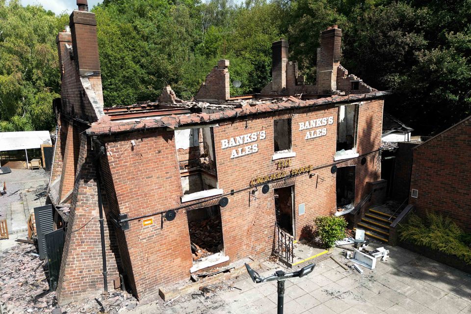 The burnt out remains of The Crooked House in August 2023 (Jacob King/PA)