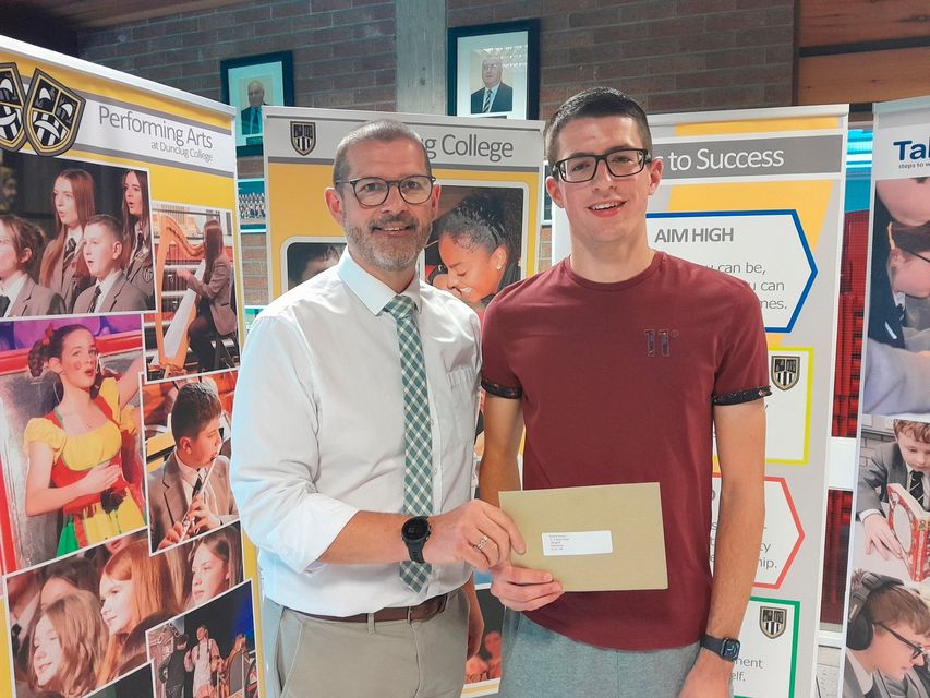 Daniel Hanna celebrates his A Level results with principal at Dunclug College Ballymena, Mr Niall Oliver.