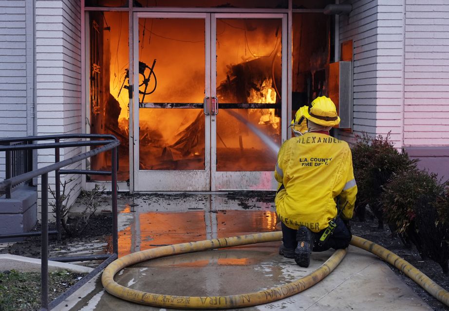 Firefighters worked to contain a fire at a Bank of America branch in Pasadena (Chris Pizzello/AP)