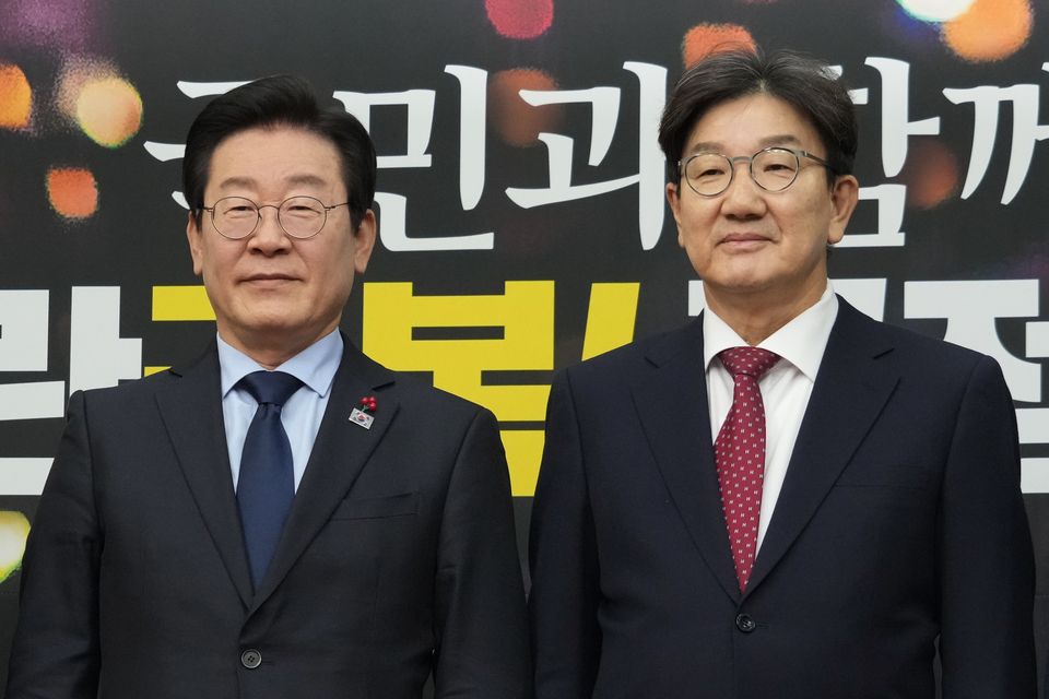 South Korea’s main opposition Democratic Party leader Lee Jae-myung, left, and Kweon Seong-dong, floor leader and interim chairperson of the ruling People Power Party (AP/Ahn Young-joon)