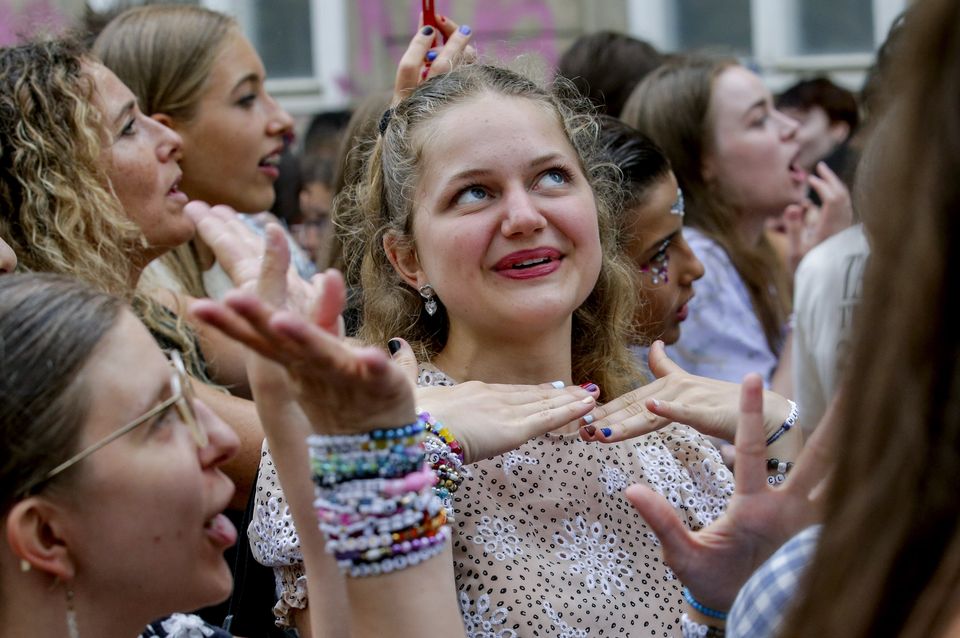 Swifties gather and sing in the city centre in Vienna on Thursday after the cancellation (Heinz-Peter Bader/AP/PA)