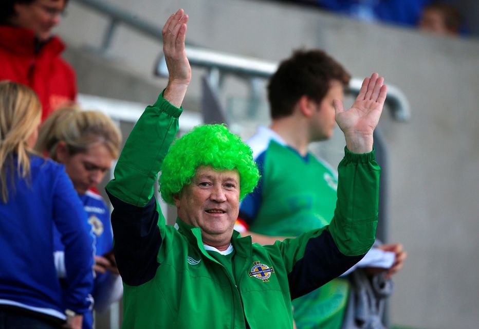 A Northern Ireland fan in the stands before the International Friendly at Windsor Park, Belfast. PRESS ASSOCIATION Photo. Picture date: Friday May 27, 2016. See PA story SOCCER N Ireland. Photo credit should read: Niall Carson/PA Wire. RESTRICTIONS: Editorial use only, No commercial use without prior permission, please contact PA Images for further information: Tel: +44 (0) 115 8447447.