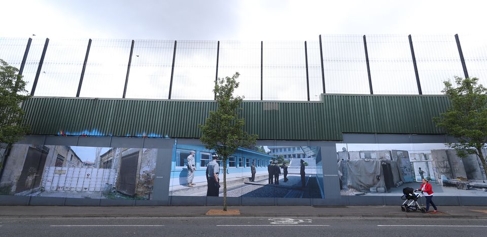 Black taxi tours of peace walls across Belfast are popular with tourists who come to ‘see the legacy of conflict and see the history’ of Northern Ireland (Niall Carson/PA)