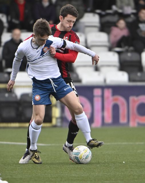 Jordan Forsythe gets to grips with Portadown's James Teelan