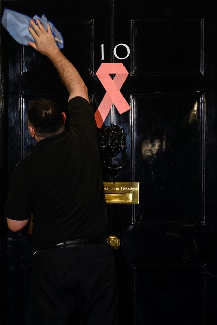 The door of number 10 is cleaned ahead of a reception hosted by Prime Minister Sir Keir Starmer to mark World Aids Day (Leon Neal/PA)