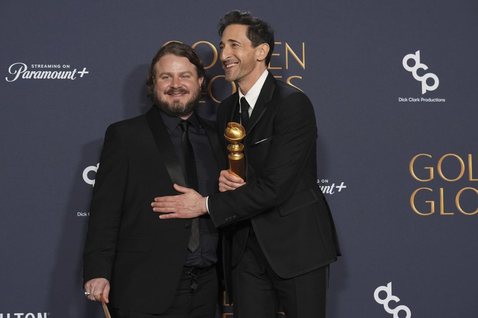 Brady Corbet, winner of the award for best director – motion picture for The Brutalist, and its star Adrien Brody (Chris Pizzello/AP)