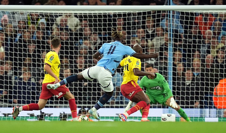 Jeremy Doku, centre, scores Manchester City’s first goal against Watford (Martin Rickett/PA)