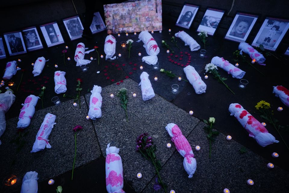 Effigies of dead babies laid out at a rally in Trafalgar Square (Victoria Jones/PA)