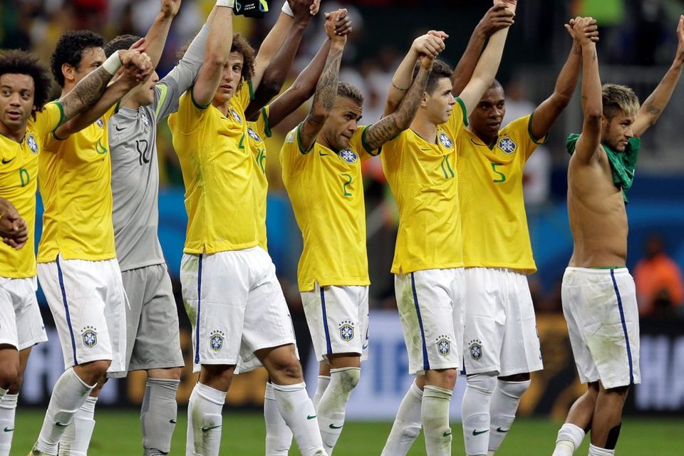 Brazil players salute their supporters following their 4-1 victory over Cameroon in the group A World Cup soccer match between Cameroon and Brazil at the Estadio Nacional in Brasilia, Brazil, Monday, June 23, 2014. (AP Photo/Natacha Pisarenko)