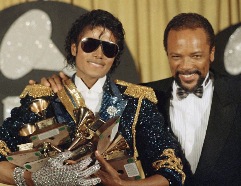 Michael Jackson, left, holds eight awards as he poses with Quincy Jones at the Grammy Awards in Los Angeles (Doug Pizac/AP)