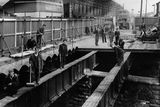 thumbnail: Workmen replace the old Donegall Road bridge spanning the Great Northern Railway main line.  17/3/1954