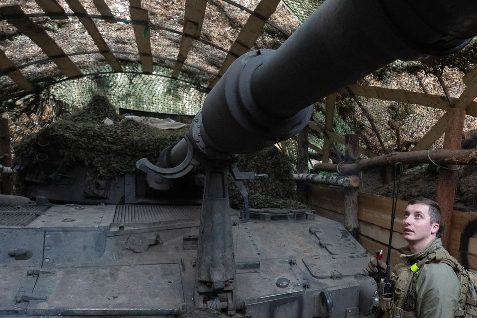 Ukrainian officer of the 92nd separate assault brigade inspects a 155mm M-109 Paladin howitzer on the frontline near Vovchansk (AP Photo/Efrem Lukatsky)