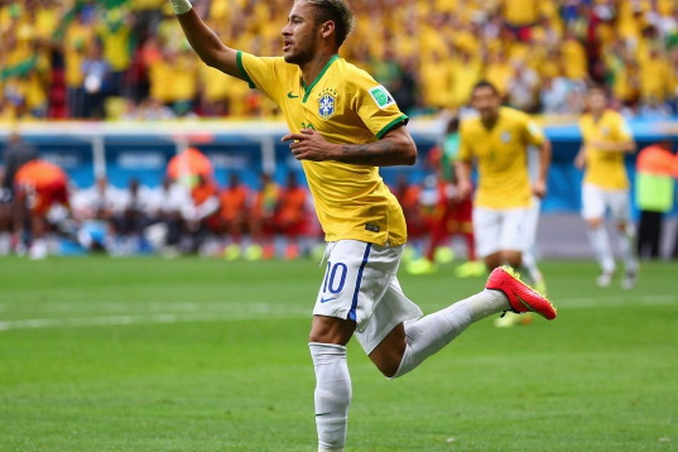 Neymar celebrates taking Brazil into the last 16 and topping Group A