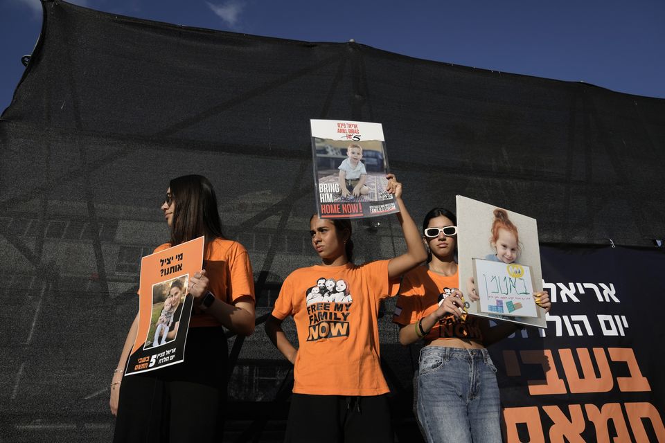 Family, friends and supporters of Ariel Bibas, who is held hostage by Hamas in the Gaza Strip, mark his fifth birthday in Tel Aviv (Mahmoud Illean/AP)