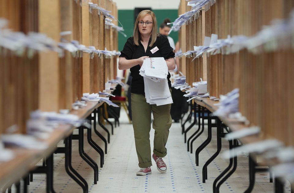 Count staff sorted ballots at Nemo Rangers GAA club in Cork during the European elections in June (Jonathan Brady/PA)