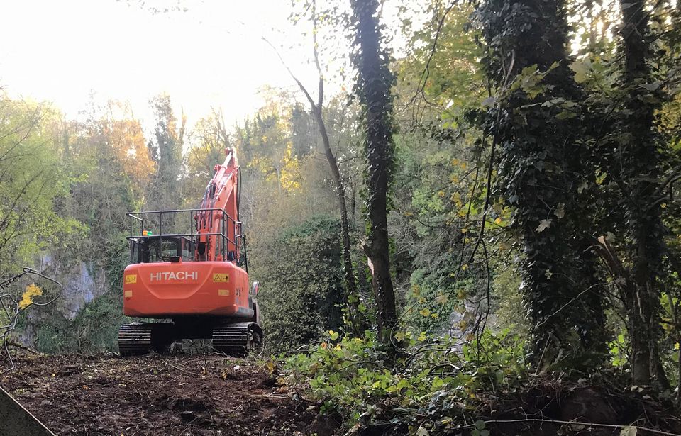 An excavator at a flooded quarry near to Benburb in Co Tyrone during a search for missing murder victim Charlotte Murray (PA)