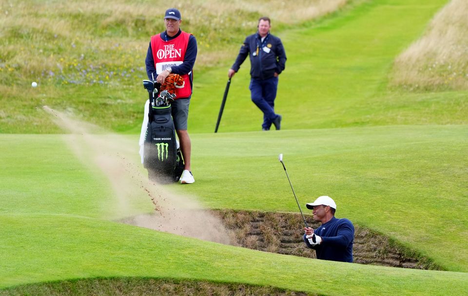 Tiger Woods failed to save par from a greenside bunker on the fifth as he headed for a missed cut in the 152nd Open (Jane Barlow/PA)