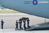 thumbnail: BRIZE NORTON, ENGLAND - JULY 01:  The coffin of Adrian Evans,  one of the victims of last Friday's terrorist attack, is taken from the RAF C-17 aircraft at RAF Brize Norton in Tunisia, on July 1, 2015 in Brize Norton, England. British nationals Adrian Evans, Charles Evans, Joel Richards, Carly Lovett, Stephen Mellor, John Stollery, and Denis and Elaine Thwaites are the first of the victims of last week's terror attack to be repatriated.  (Photo by Joe Giddens-WPA Pool/Getty Images) *** BESTPIX ***
