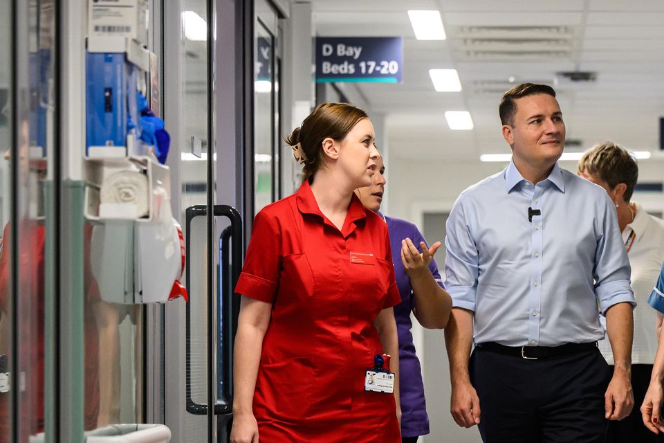 Chancellor of the Exchequer Rachel Reeves and Health Secretary Wes Streeting speaking to staff during a visit to St George’s Hospital, Tooting, last week (Leon Neal/PA)