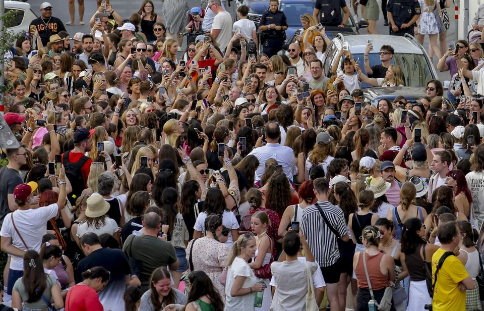 Hundreds of people gathered just three miles from the stadium (AP Photo/Heinz-Peter Bader)